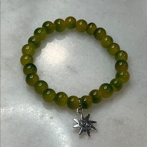 Green Beaded Bracelet with Silver Sun Charm